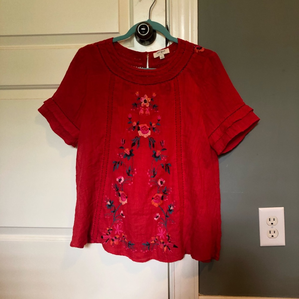 Red top with floral embroidery